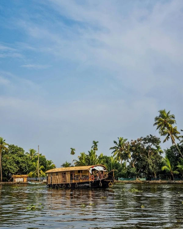 Houseboat cruising through the backwaters of Alleppey, Kerala